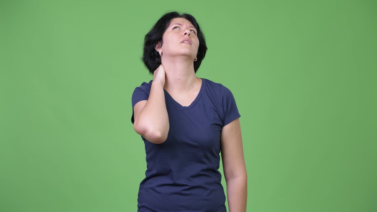 Stressed woman with short hair having neck pain