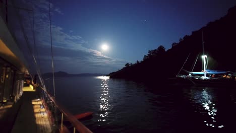 Full-moon-View-reflecting-in-Mediterranean-Sea-from-a-boat-at-night,-Turkey,-Greece-near-Kos