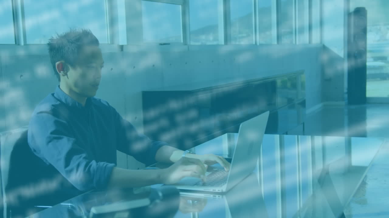 Animation of data processing over businessman using laptop
