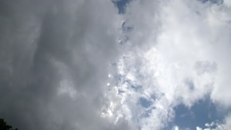 Nature-storm-clouds-parting-blue-sky