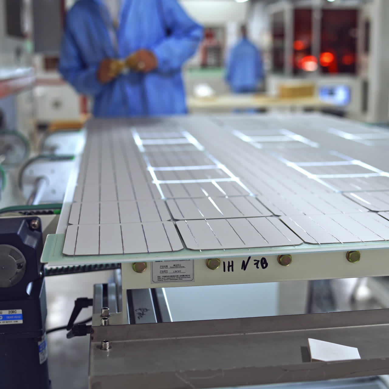 Producing process of solar panel. Automated technology of producing solar cells. Ready solar panel on the board on a modern factory background.