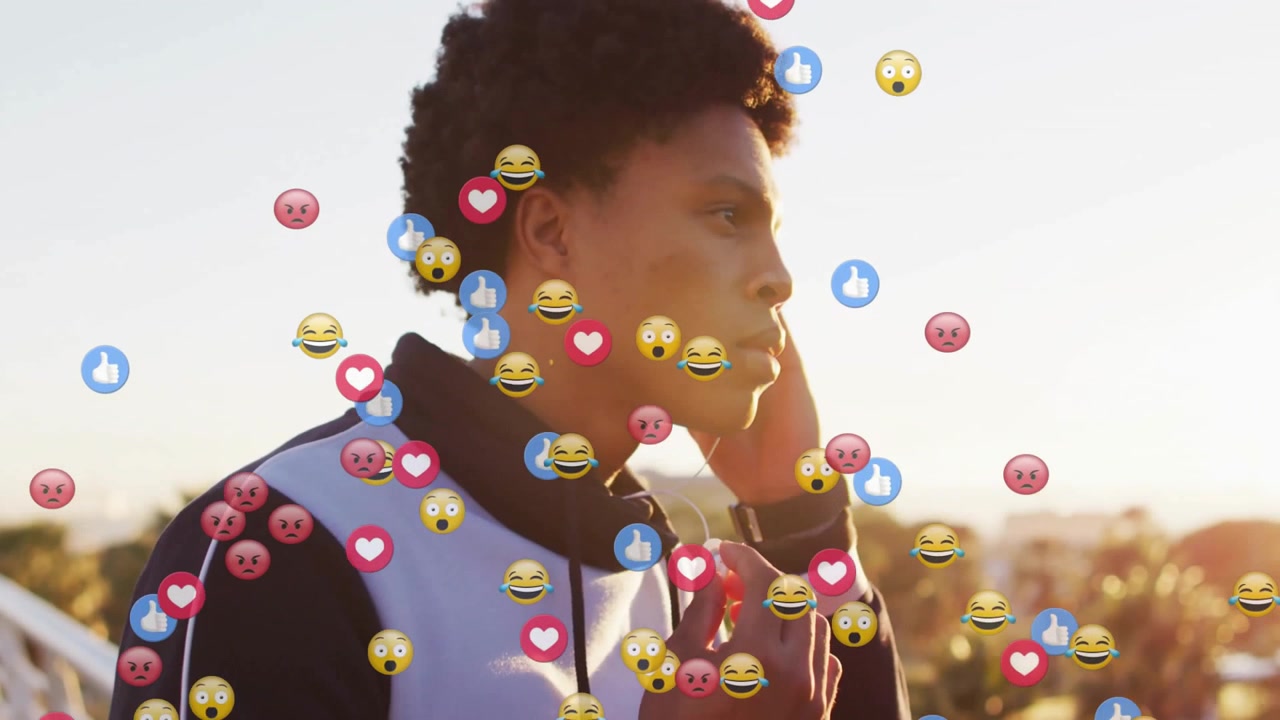 Young African American Man Listening to Music with Social Media Emojis