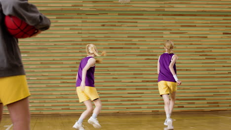 teenagers in basketball court