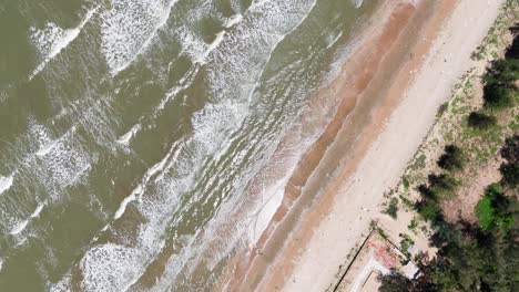 aerial view of the waves at the beach in lam dong
