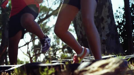 kids running over tyres during obstacle course training