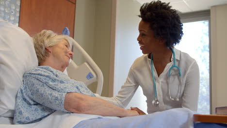 doctor talks to senior patient in hospital bed shot on r3d