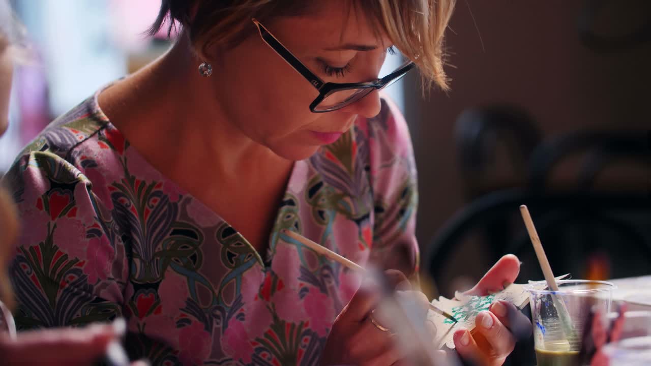 Woman painting a piece of art