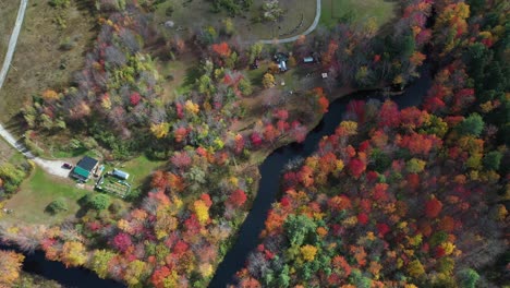 Birdseye-Aerial-View-of-Colorful-Forest-and-River-in-Rural-Maine-New-England-USA-on-Sunny-Autumn-Day