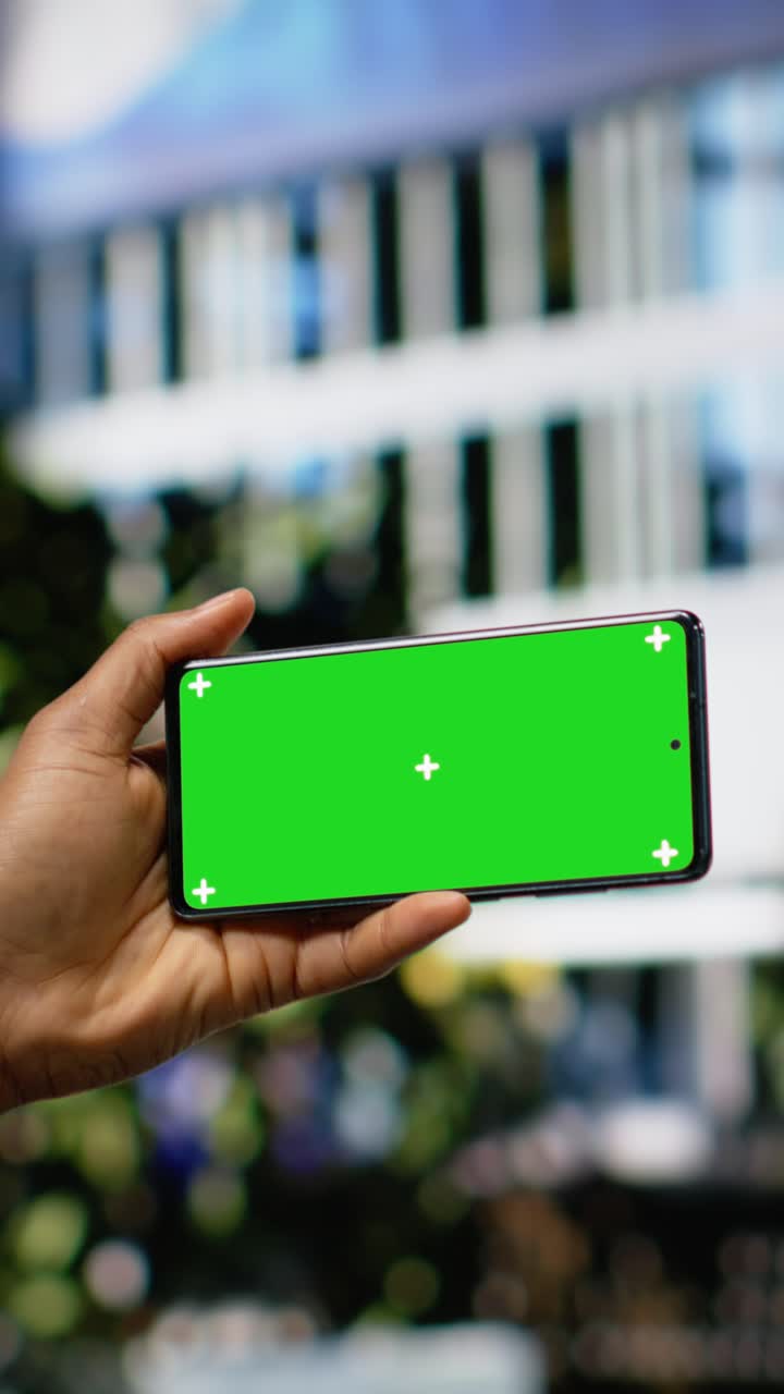 Vertical Video Horizontal green screen phone with man sitting on a wooden bench