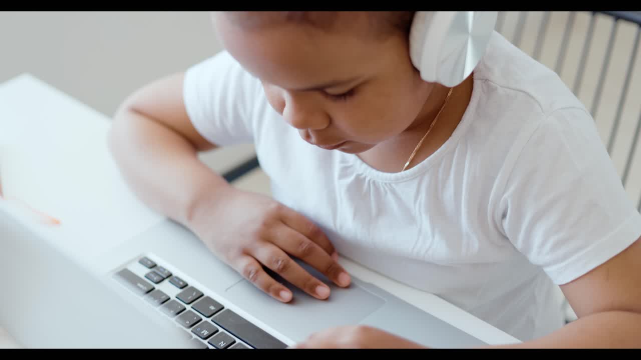 Young Girl Learning on a Laptop
