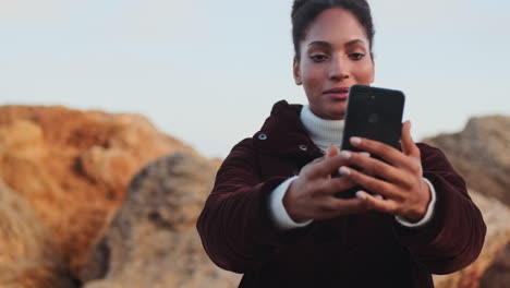 african american girl having a video call outdoors.