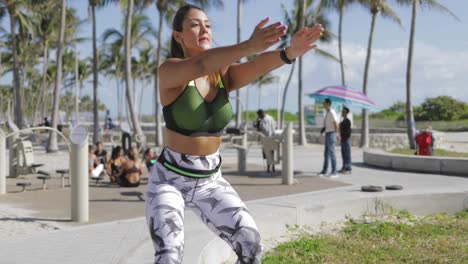 Woman-knee-bending-in-sunny-park