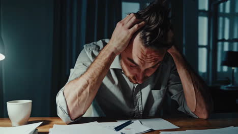 stressed man at desk