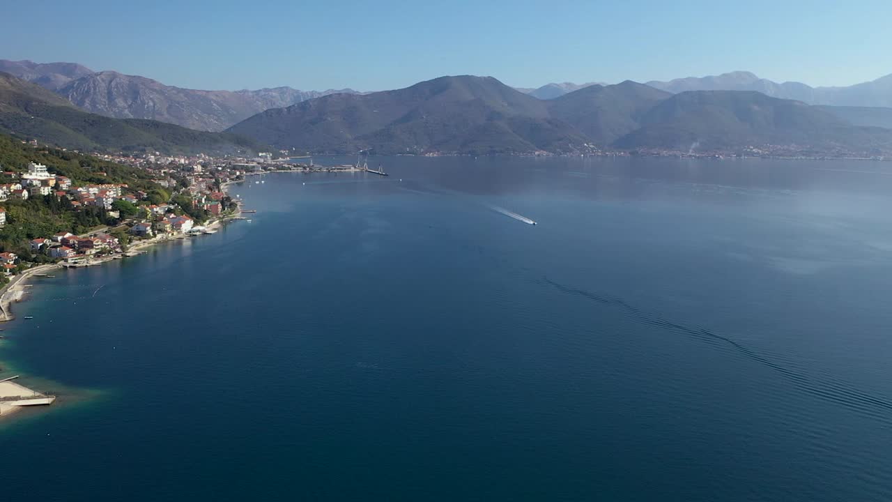Boat sailing near coast town