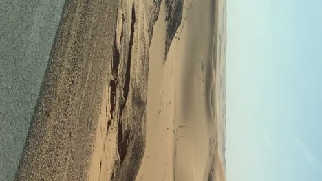 vertical desert landscape passing by from car passenger pov