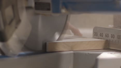 extreme close up shot of a circular saw cutting skirting board