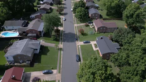 drone flying over leesburg neighborhood, single family homes tilting up down street