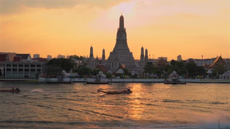Bangkok,Wat Arun temple during Golden Hour,Top of the temple is shining.Still Frame.