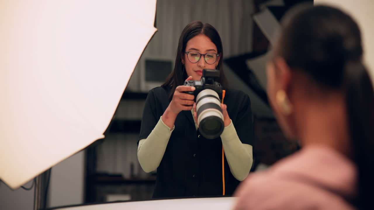 Photographer in studio taking portrait