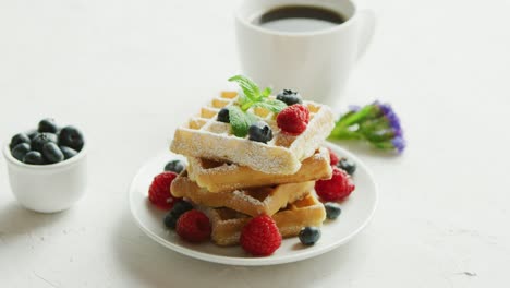 Waffles-on-plate-and-cup-of-coffee