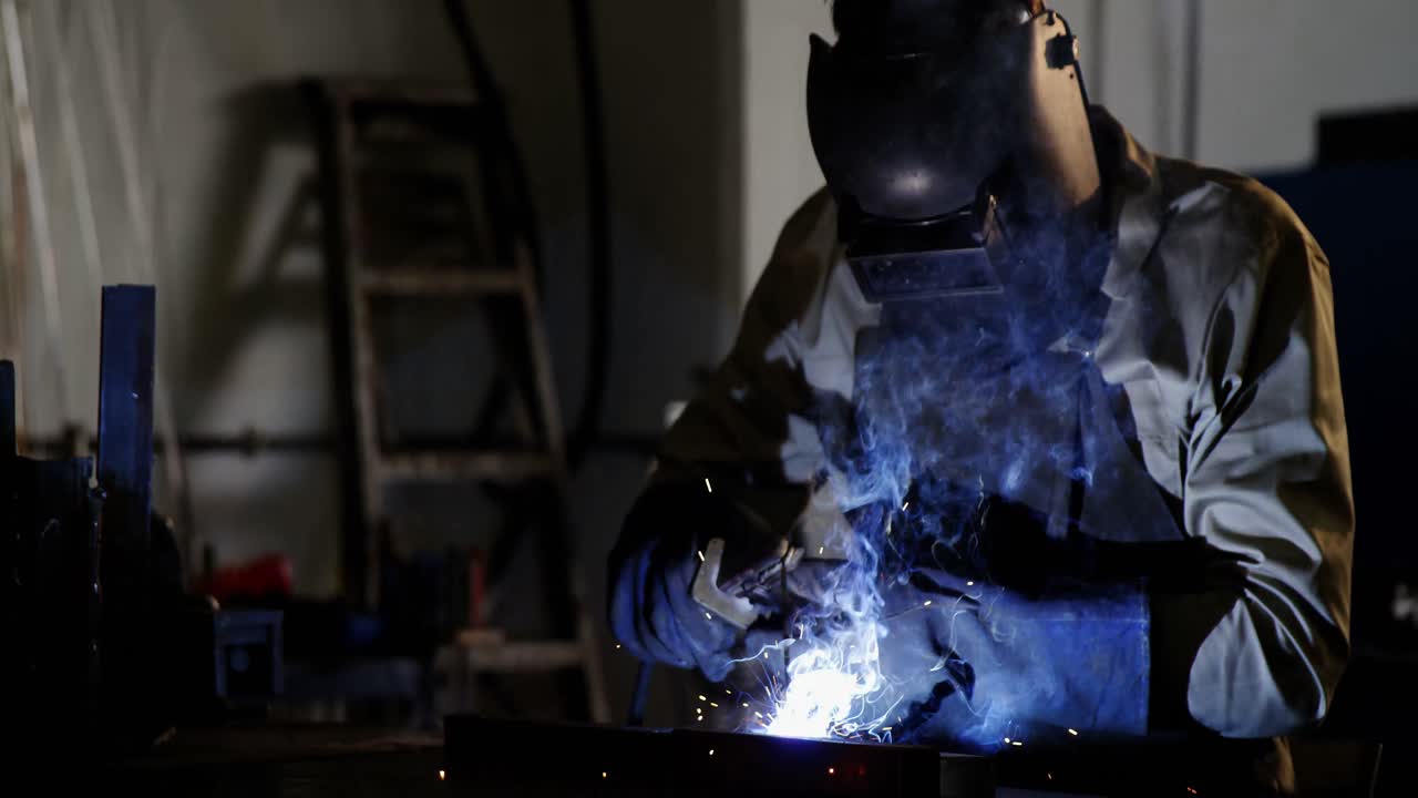Welder welding a metal