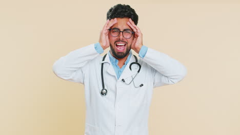 irritated angry indian doctor man screams from stress tension problems, shock, rage, nervous quarrel