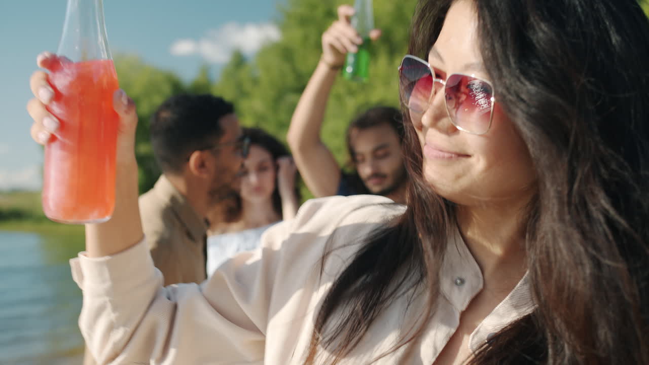 Friends Enjoying a Summer Day by the River