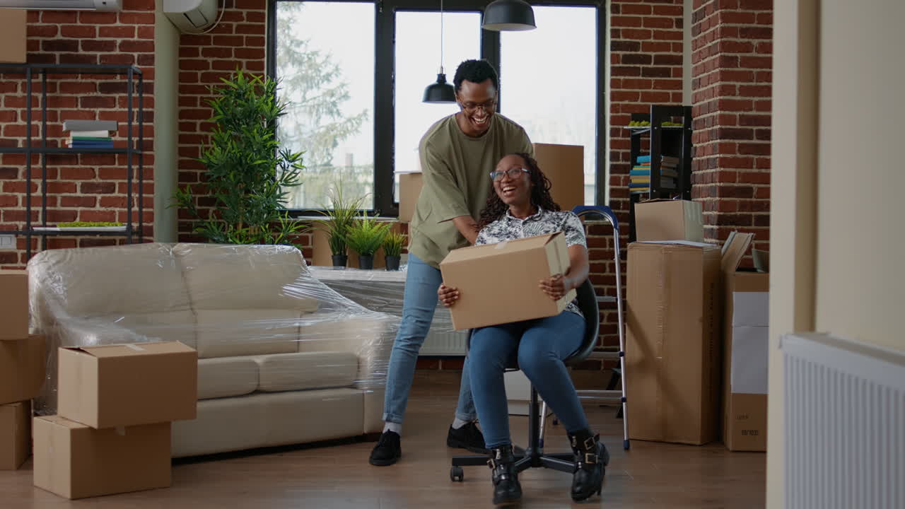 Married couple feeling happy about moving in together in new home