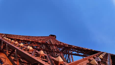 eiffel tower paris france landmark puddle iron structure up-close close up, clear blue sky