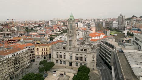 front view of the camara municipal of porto with cityscape in background on a cloudy day in portugal