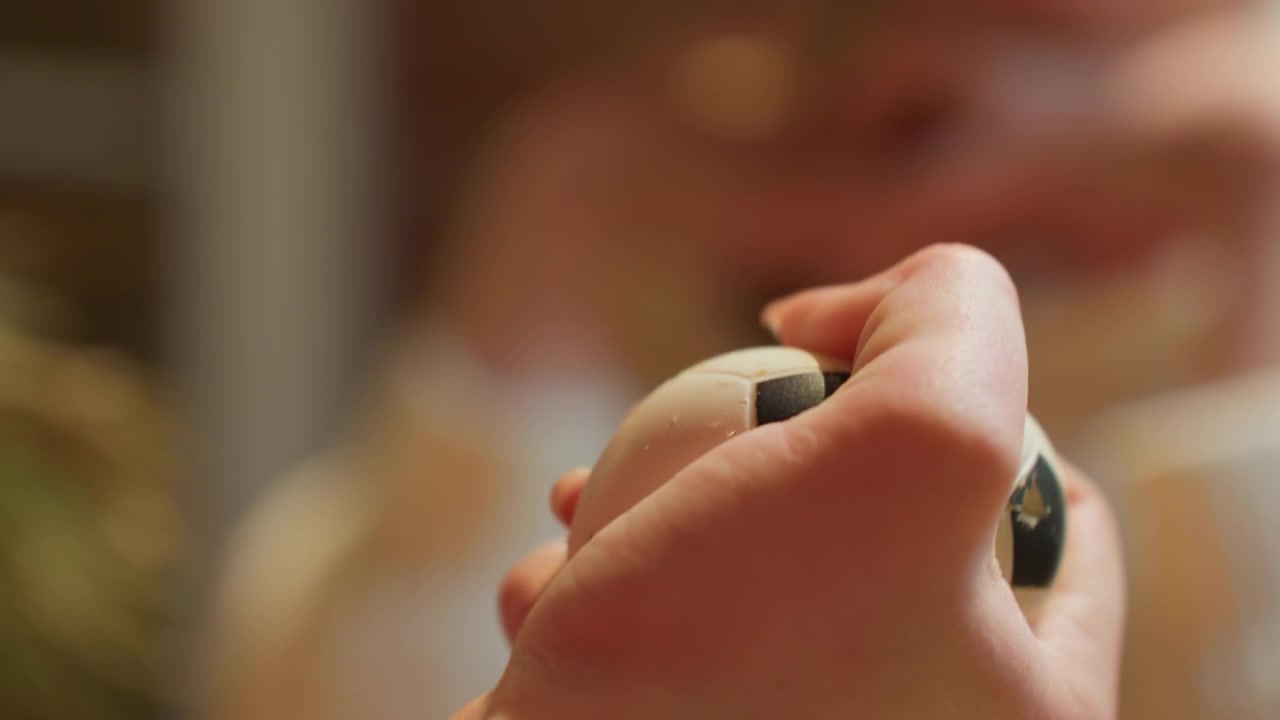 Close-Up of Hand Squeezing a Small Soccer Ball Stress Toy