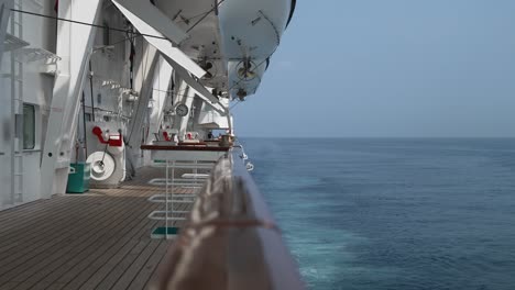 View-on-Passenger-Cruise-Ship-Life-Boat-Deck,-Ferry-Open-Wooden-Deck,-Cruising-through-the-Ocean-On-Board-of-a-Cruise-Ship-Vessel,-Vacation-on-Sea