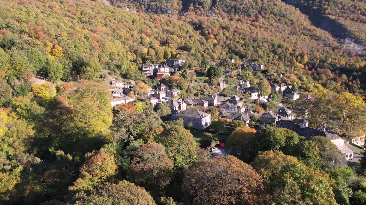 Mikro Papigo Reveal Through Autumn Nature, Aerial Dolly Shot of Traditional Village in Zagorochoria Ioaanina Greece
