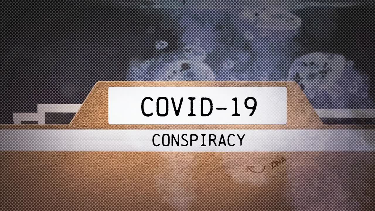 Animazione del testo 'cospirazione COVID-19' sopra il globo