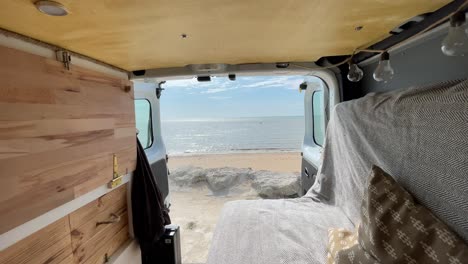 static view from inside a furnished van of a magnificent sea panorama