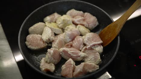 cooking chicken in a pan