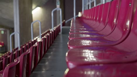 empty red color seat row in massive arena, motion view