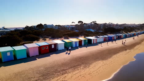 colorful beach huts on the coastline