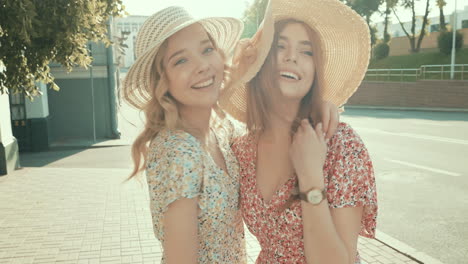 two women friends in summer hats