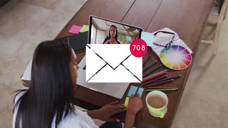 Animation-of-email-icon-with-numbers-over-caucasian-woman-on-laptop-video-call