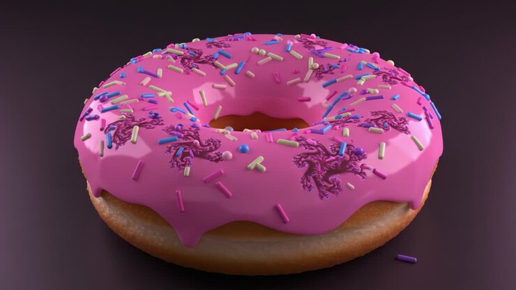 Primo piano di una deliziosa ciambella rosa con glassa e codette colorate, realizzata alla perfezione per veri amanti di dolci e dessert