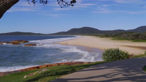 blue waves at south west rocks - empty beach during covid-19 pandemic - nsw, australia