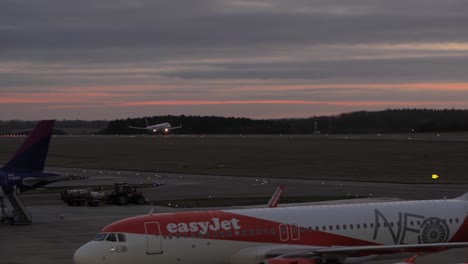 wizzair plane coming to land at sunrise.