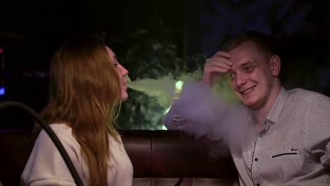 couple smoking hookah