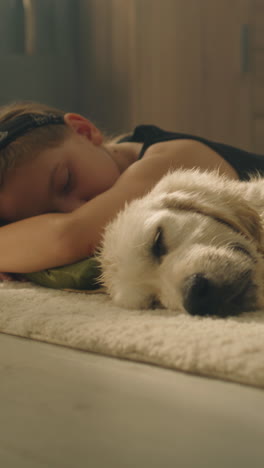 girl and puppy sleeping together