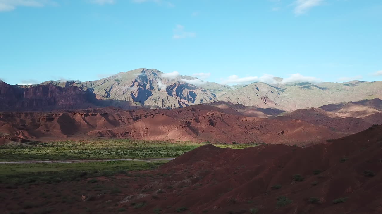 Scenic Landscape of Calchaqui, Argentina. Drone Aerial View of Green Valley, Red Rock Hills and Blue Sky