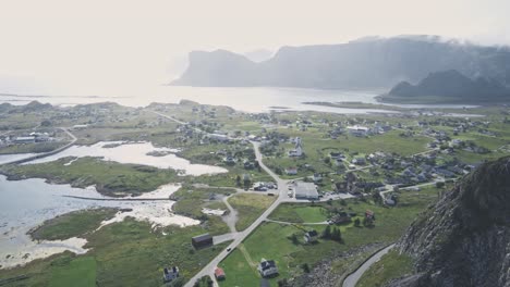 small living town on norwegian coastline with majestic mountain landscape