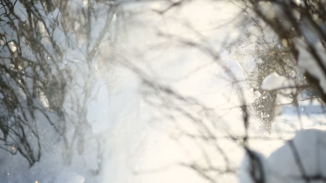 Mother with son walking on snow. Little boy with mother walking in snowy winter day
