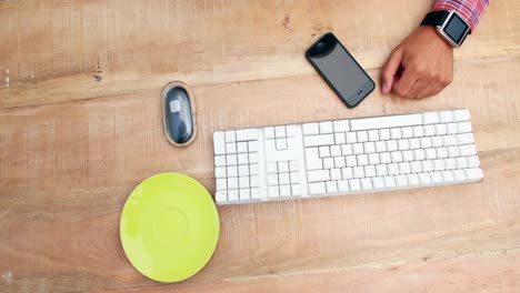 overhead of man working at desk