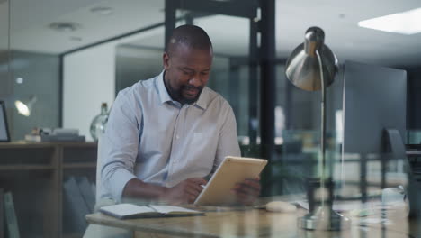 a-mature-businessman-using-a-digital-tablet